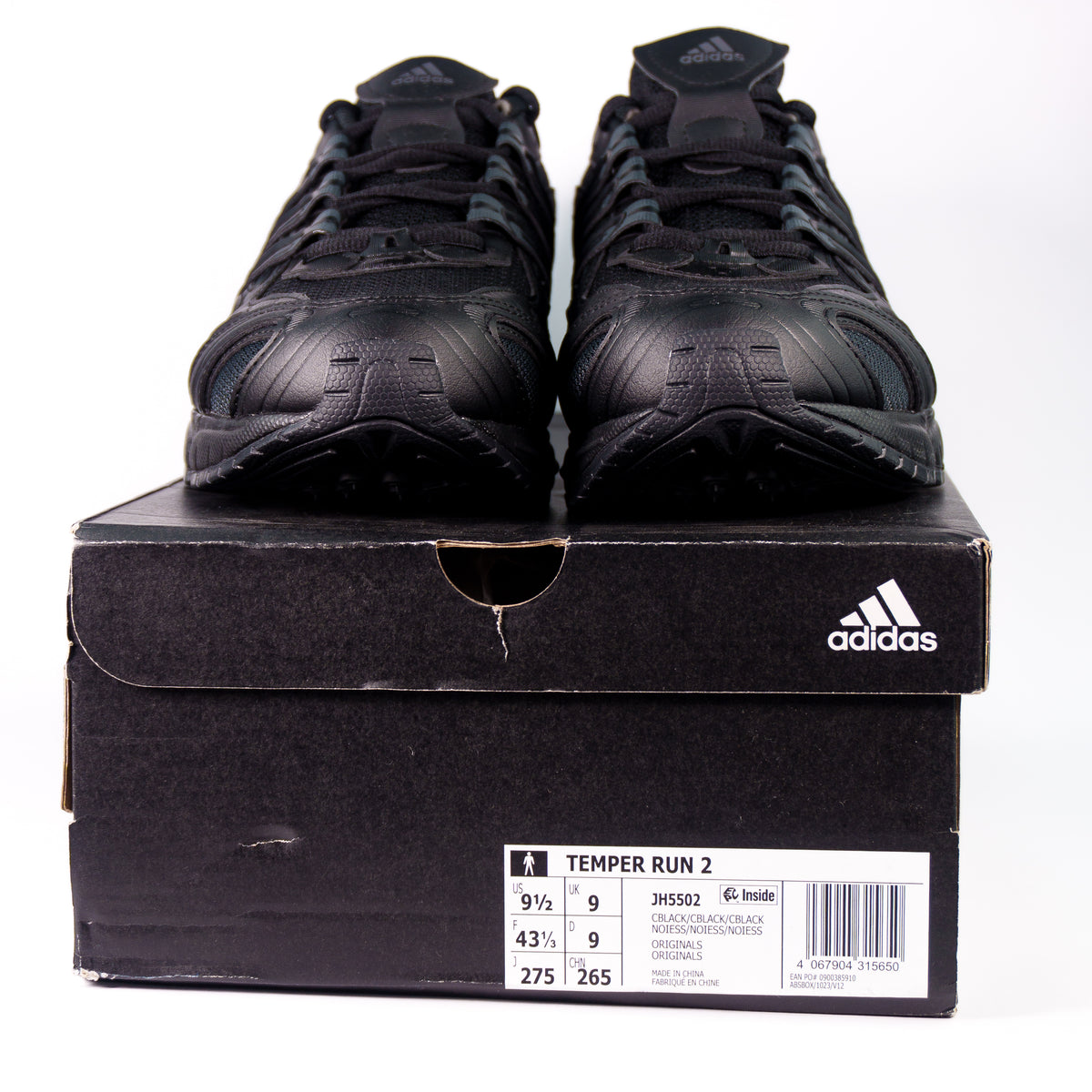 Adidas Temper Run 2.0 Full Black на чорній коробці Adidas з етикеткою JH5502